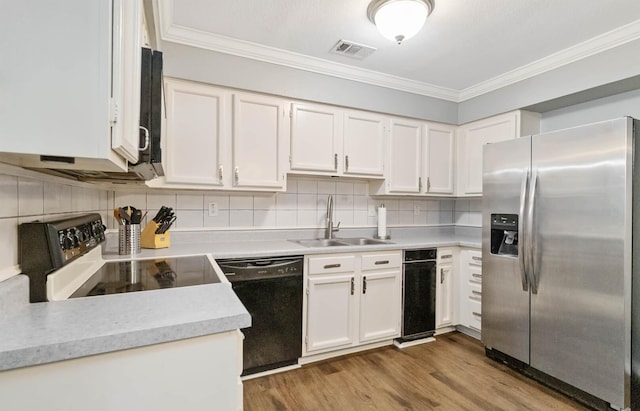 4119 Medical Dr Unit E104, San Antonio, TX 78229 - kitchen featuring ornamental molding, black dishwasher, stainless steel fridge, a sink, and range with electric cooktop