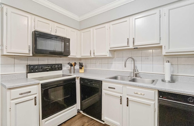 4119 Medical Dr Unit E104, San Antonio, TX 78229 - kitchen featuring crown molding, a sink, light countertops, tasteful backsplash, and black appliances