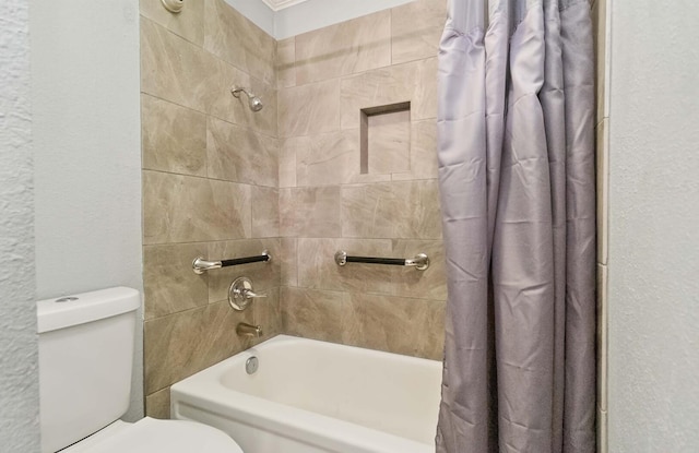 4119 Medical Dr Unit E104, San Antonio, TX 78229 - full bathroom featuring toilet, a textured wall, and shower / tub combo with curtain