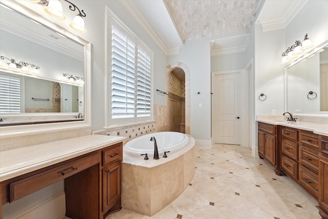 bathroom featuring ornamental molding, a garden tub, tile patterned flooring, and vanity