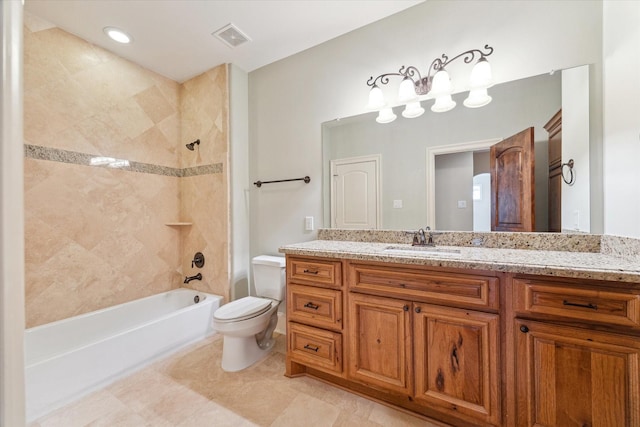 full bath with visible vents, washtub / shower combination, toilet, and vanity