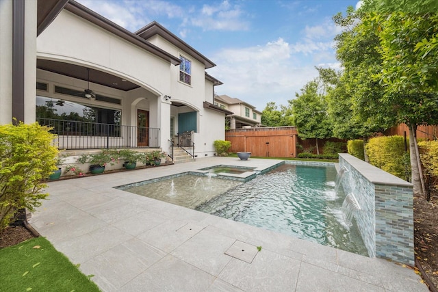 view of pool featuring a patio, ceiling fan, fence private yard, and a pool with connected hot tub