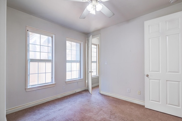 5976 Kansas St, Houston, TX 77007 - unfurnished room with plenty of natural light, carpet flooring, and baseboards