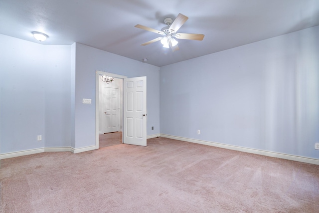 5976 Kansas St, Houston, TX 77007 - unfurnished bedroom featuring carpet floors, baseboards, and ceiling fan