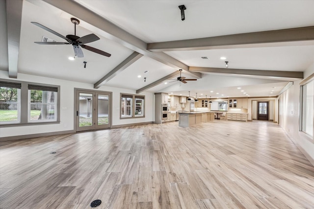 5807 Lilac St, Katy, TX 77493 - unfurnished living room with a wealth of natural light, vaulted ceiling with beams, light wood-style flooring, and a ceiling fan