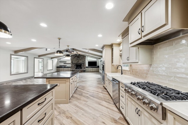 5807 Lilac St, Katy, TX 77493 - kitchen with tasteful backsplash, open floor plan, dark countertops, stainless steel appliances, and vaulted ceiling with beams