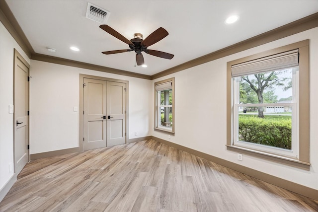 5807 Lilac St, Katy, TX 77493 - unfurnished bedroom with crown molding, visible vents, baseboards, and light wood-type flooring