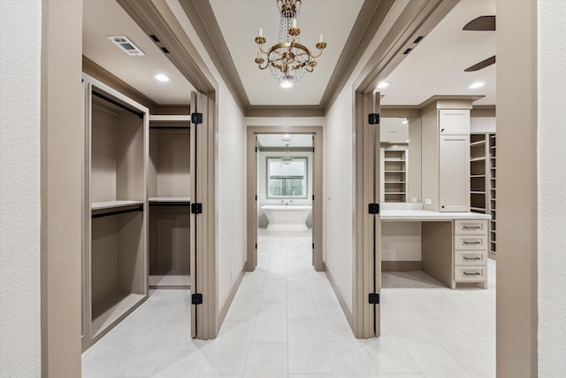 5807 Lilac St, Katy, TX 77493 - hall with crown molding, an inviting chandelier, baseboards, and visible vents