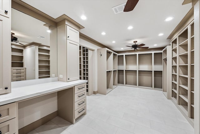 5807 Lilac St, Katy, TX 77493 - spacious closet featuring built in desk, a ceiling fan, and visible vents