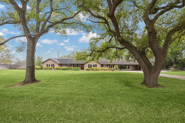 5807 Lilac St, Katy, TX 77493 - view of front of property featuring driveway, fence, and a front lawn