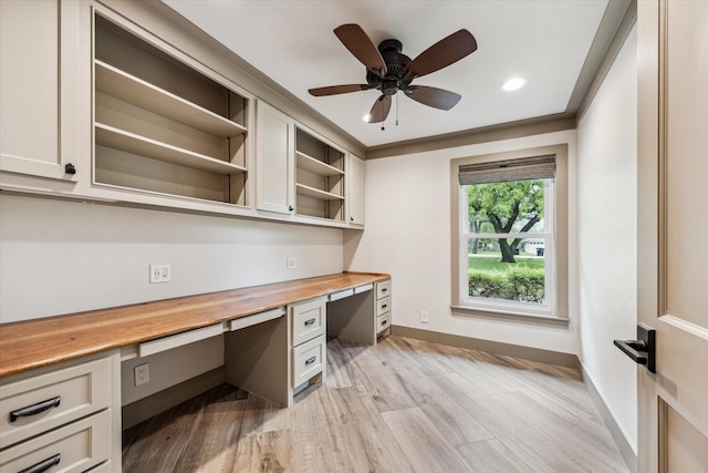 5807 Lilac St, Katy, TX 77493 - unfurnished office with built in desk, light wood-type flooring, a ceiling fan, and baseboards
