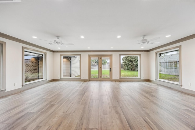 5807 Lilac St, Katy, TX 77493 - unfurnished living room with light wood-style flooring, baseboards, a ceiling fan, and ornamental molding