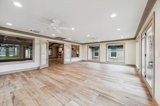 5807 Lilac St, Katy, TX 77493 - unfurnished living room featuring visible vents, ceiling fan, ornamental molding, and light wood-style flooring