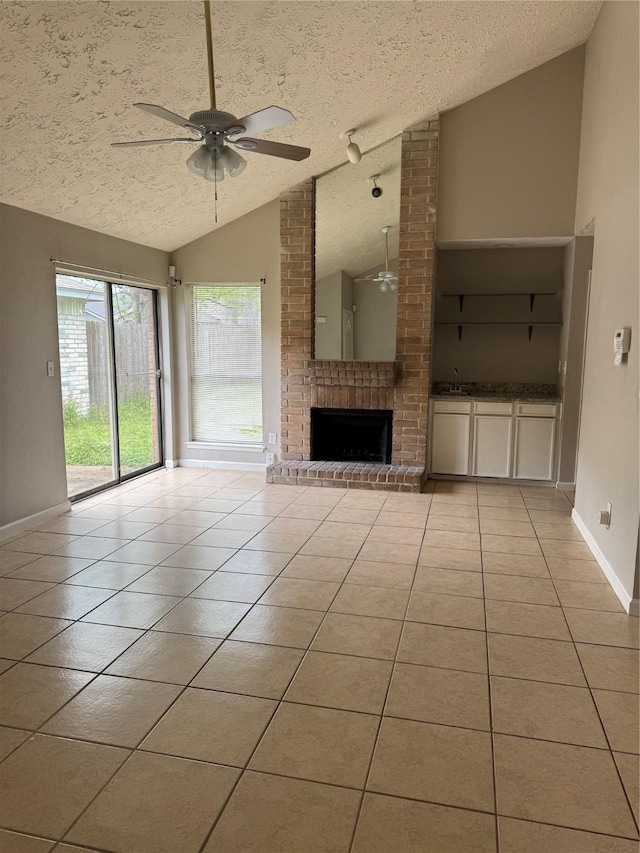 10726 Staghill Dr, Houston, TX 77064 - unfurnished living room featuring light tile patterned floors, a textured ceiling, a ceiling fan, and lofted ceiling