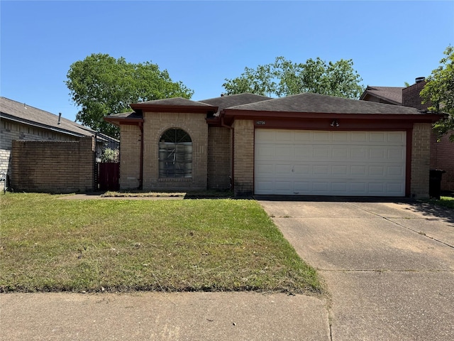 10726 Staghill Dr, Houston, TX 77064 - view of front of home featuring brick siding, a front lawn, a garage, and concrete driveway