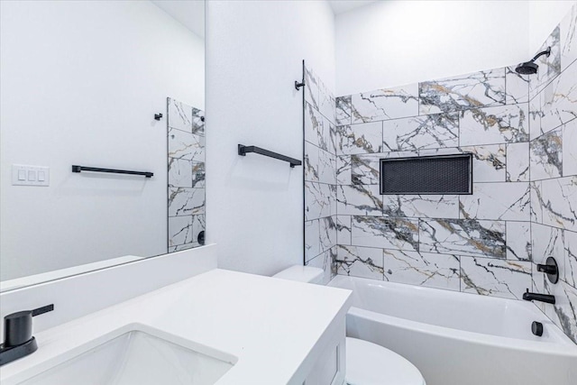 bathroom with vanity, shower / bathing tub combination, and toilet
