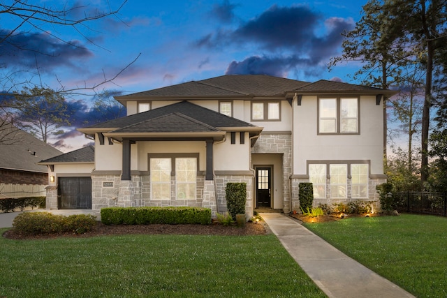 10593 Lake Palmetto Dr, Conroe, TX 77385 - view of front of home with stone siding, stucco siding, and a garage