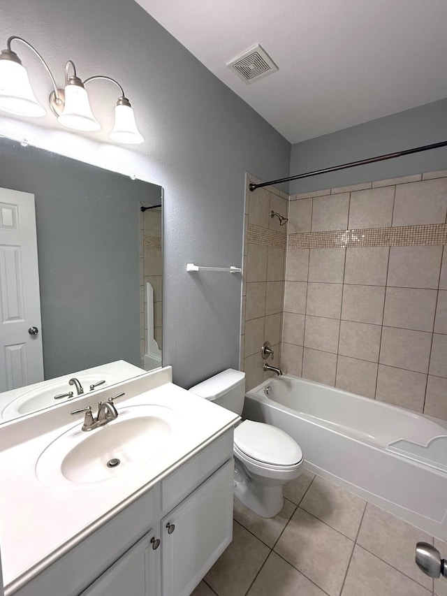 bathroom with visible vents, toilet, tub / shower combination, vanity, and tile patterned floors