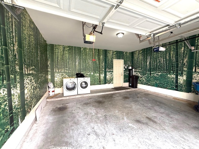 garage featuring washer and clothes dryer and a garage door opener