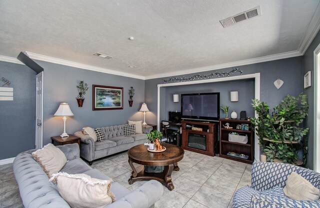 living area with visible vents, a textured ceiling, and crown molding