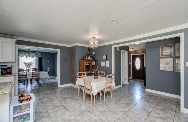 dining area with baseboards, a notable chandelier, and ornamental molding