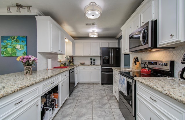 kitchen featuring visible vents, white cabinets, and black appliances