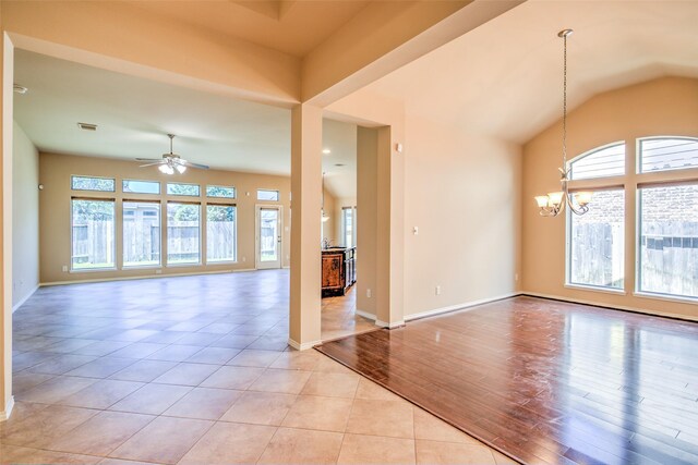 16007 Angler Bend Dr, Houston, TX 77044 - interior space with a wealth of natural light, visible vents, ceiling fan with notable chandelier, and baseboards