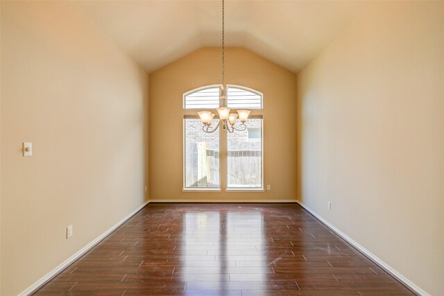 16007 Angler Bend Dr, Houston, TX 77044 - unfurnished dining area featuring dark wood-style flooring, baseboards, a chandelier, and vaulted ceiling