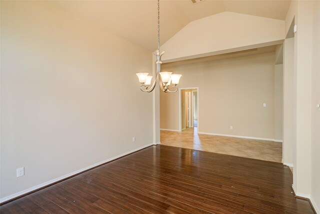 16007 Angler Bend Dr, Houston, TX 77044 - unfurnished room featuring a chandelier, baseboards, vaulted ceiling, and hardwood / wood-style floors