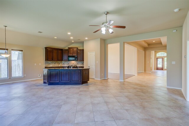 16007 Angler Bend Dr, Houston, TX 77044 - kitchen with plenty of natural light, black microwave, open floor plan, and a ceiling fan