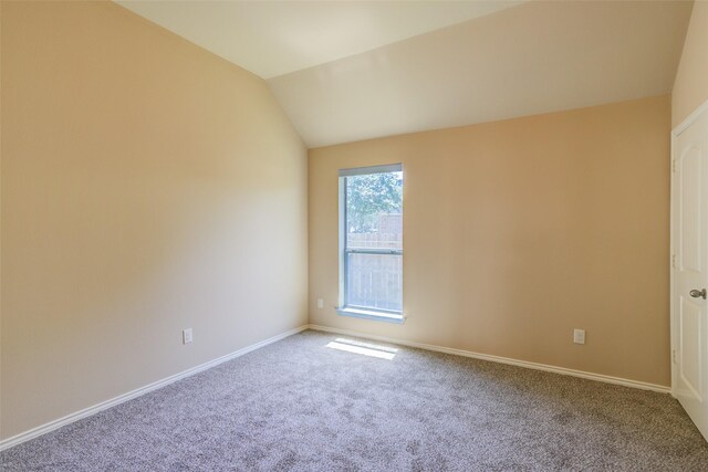 16007 Angler Bend Dr, Houston, TX 77044 - carpeted empty room with baseboards and vaulted ceiling