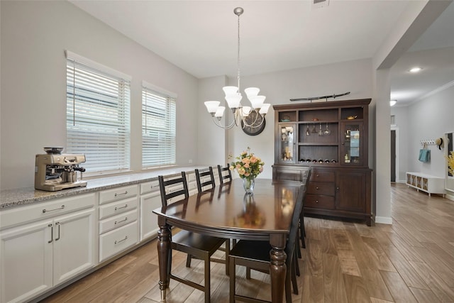 dining area featuring a chandelier, recessed lighting, light wood finished floors, and baseboards