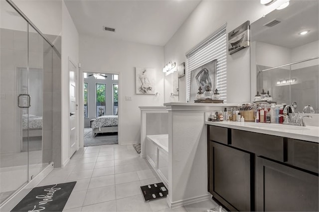 ensuite bathroom with a stall shower, vanity, tile patterned flooring, and visible vents