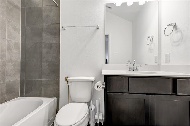 bathroom featuring toilet, vanity, and shower / washtub combination