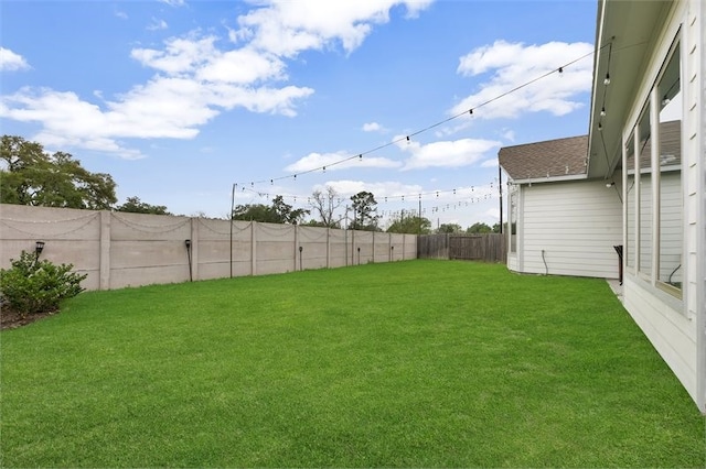 view of yard featuring a fenced backyard