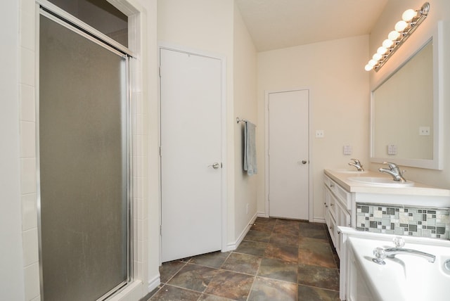 full bath featuring a stall shower, stone finish flooring, baseboards, and a bathtub