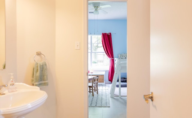 bathroom with a sink and a ceiling fan