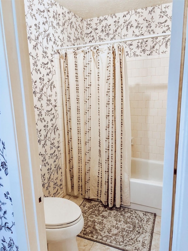 16111 Queensdale Dr, Houston, TX 77082 - full bathroom featuring toilet, wallpapered walls, tile patterned flooring, and shower / bath combo with shower curtain