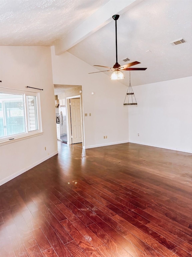 16111 Queensdale Dr, Houston, TX 77082 - unfurnished living room featuring ceiling fan, baseboards, vaulted ceiling with beams, visible vents, and dark wood-style floors