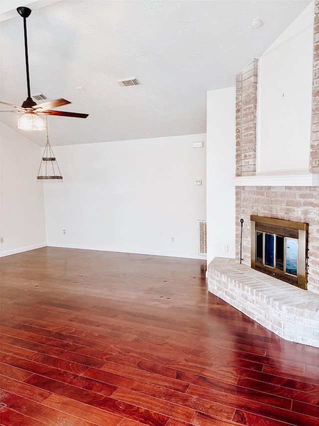 16111 Queensdale Dr, Houston, TX 77082 - unfurnished living room with a ceiling fan, visible vents, a fireplace, hardwood / wood-style flooring, and baseboards