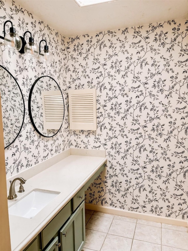 16111 Queensdale Dr, Houston, TX 77082 - bathroom featuring baseboards, tile patterned floors, vanity, and wallpapered walls