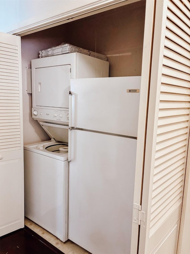 16111 Queensdale Dr, Houston, TX 77082 - laundry room with stacked washer and clothes dryer and laundry area