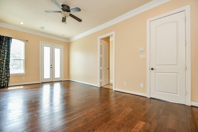 empty room with baseboards, ornamental molding, french doors, a ceiling fan, and dark wood finished floors
