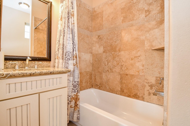 bathroom with shower / bath combo with shower curtain and vanity
