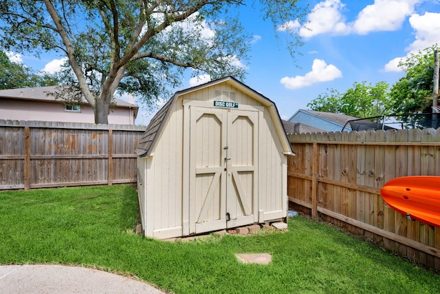 view of shed with a fenced backyard