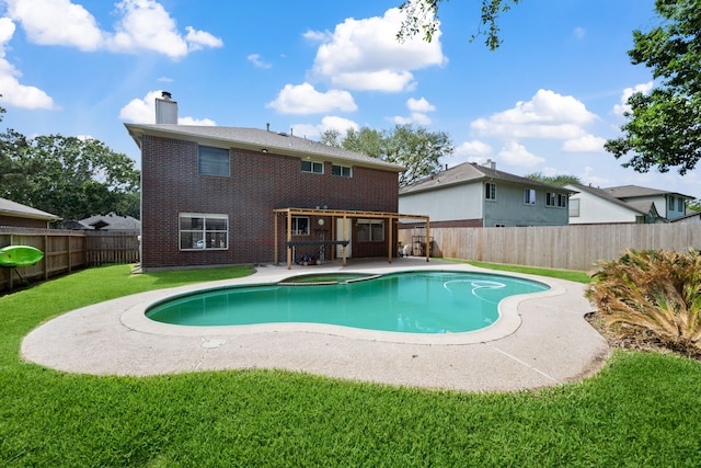 view of pool with a patio, a fenced backyard, and a yard