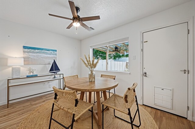 4309 Kingfish Dr, Seabrook, TX 77586 - dining area with ceiling fan, light wood-style floors, and baseboards