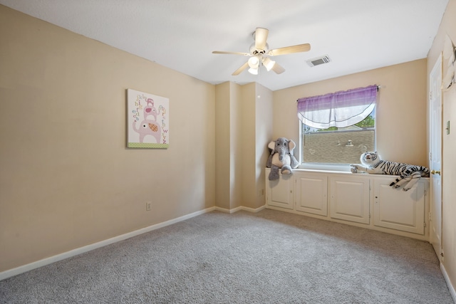 unfurnished room featuring light colored carpet, visible vents, ceiling fan, and baseboards