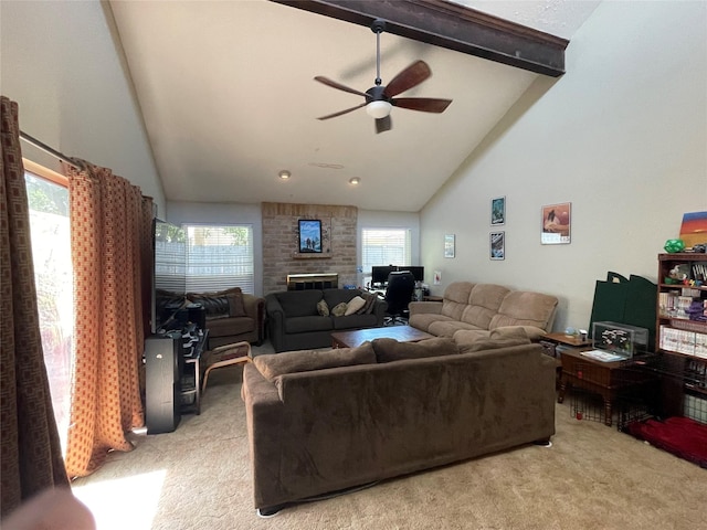 living area featuring light colored carpet, ceiling fan, a wealth of natural light, and high vaulted ceiling