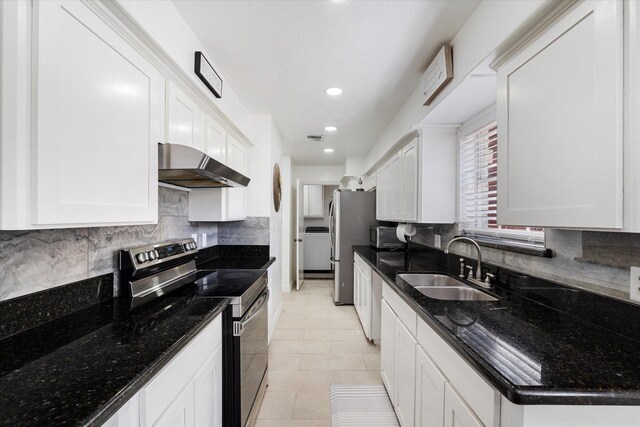9203 Mauna Loa Ln, Houston, TX 77040 - kitchen with washer / clothes dryer, exhaust hood, white cabinets, stainless steel appliances, and a sink